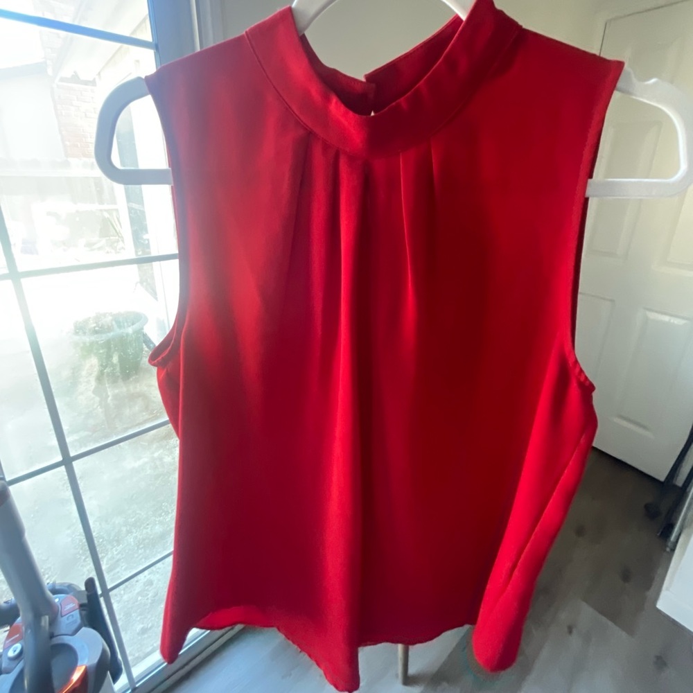 Red sleeveless blouse